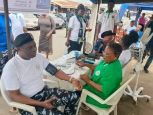 The Commissioner of Police, CP Abimbola Olugbenga checking his blood pressure during a medical outreach and sanitation exercise to make the 2026 National Police Day on Monday in Ibadan 