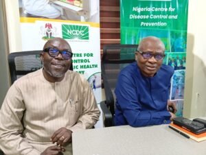 The Head, Central Public Health Laboratory, NCDC, James Avong with the D-G, NCDC, Dr Jude Idris during the press conference on Friday in Lagos 