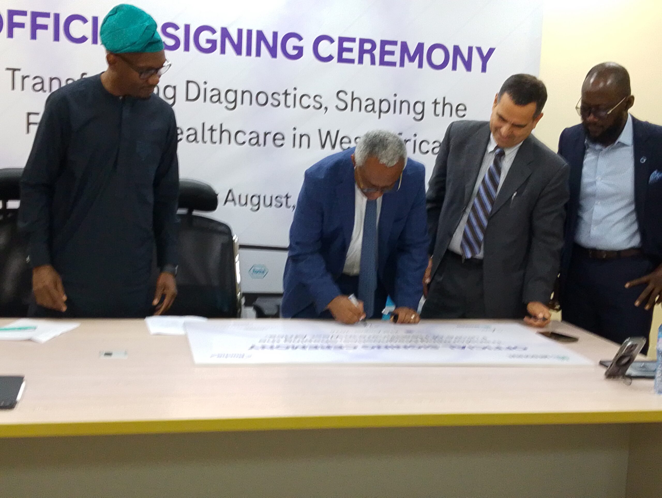 The Managing Director and Chief Executive Officer of MedServe, Dr Tolulope Adewole signing the agreement