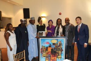 Amb. Jimoh Ibrahim, Permanent Representative of Nigeria to the UN (3rd left) presenting gifts to Mrs Ahunna Eziakonwa who has just been appointed Special Adviser on Africa to the UN Secretary-General António Guterres. They were flanked by UN Deputy Secretary-General Amina Mohammed and members of Eziakonwa's family and senior UNDP staff at a UNDP reception for Eziakonwa at Nigeria House in New York